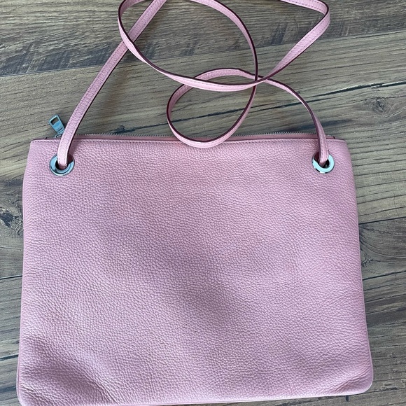 Gently used blush pink leather Coach crossbody bag with silver chain. - Picture 2 of 5
